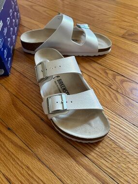 Birkenstock White Textured Two-Strap Sandals with Silver Buckles